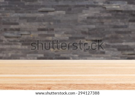 Empty top of wooden table or counter and black slat wall background