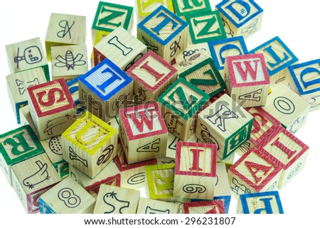 Stack of colorful alphabet blocks isolated on white background