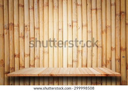 Empty top wooden shelves and bamboo wall background. For product display
