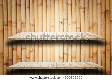 Empty top wooden shelves and bamboo wall background. For product display