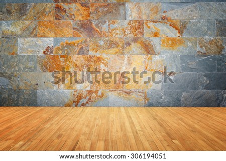 Empty top of wooden floor and natural stone wall background
