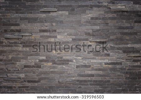 Pattern of black slate wall texture and background
