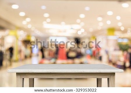 Empty top of natural stone table and blur with bokeh background. For product display