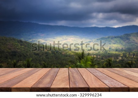 Empty top wooden table and view of mountain. Can use for product display