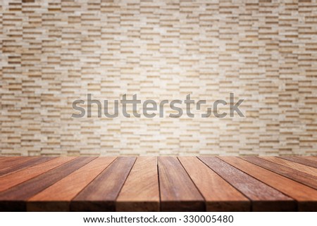 Empty top wooden table and natural stone wall background. For product display