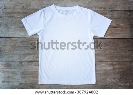 Top view of color T-Shirt on grey wood plank background