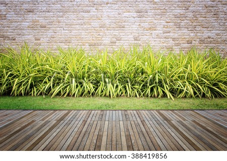Wooden decking and plant with wall garden decorative