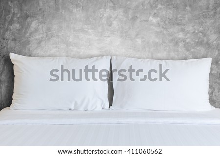 Close up white bedding sheets and pillow in hotel room
