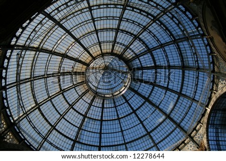 The dome of the wonderful gallery Vittorio Emanuele between the duomo and P.za della Scala in Milan (Italy).