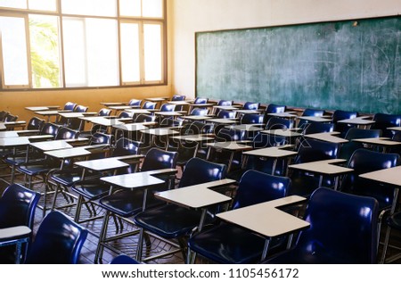 selective soft and blur focus.side view.old wooden row lecture chairs in dirty classroom in poor school.study room without student.concept for education