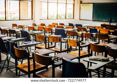 selective soft and blur focus.old wooden row lecture chairs in classroom in poor school.study room without student.concept for education