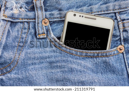 White phone in jeans pocket