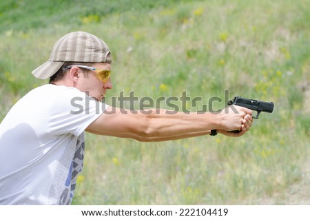 Man shoots a gun at the shooting range