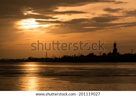 Chaopraya river in sunset sky and land silhouette.