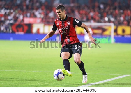 NONTHABURI,THAILAND-MARCH 11 : Cleiton Silva of Muangthong United run with the ball during the game between SCG Muangthong United and Srisaket FC at SCG Stadium on March 11, 2015 in,Thailand.