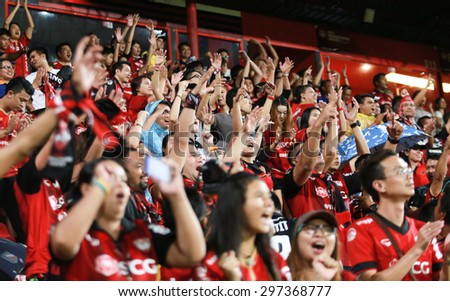 NONTHABURI,THAILAND-JULY 15: The fan club of MTUTD put their hand up and cheer between the game SCG Mungthong United and Rachaburi Mitrpol F.C. at SCG Mungthong Stadium on July 15, 2015 in,Thailand.