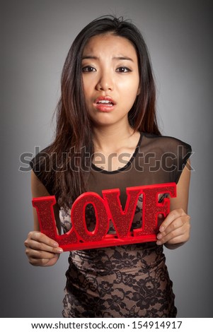 Romantic people in love shot in studio isolated on a grey background
