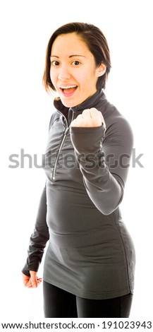 Young woman punching the air and smiling