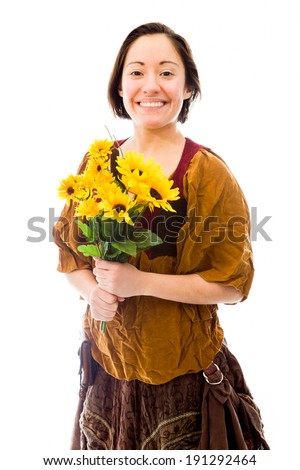 Young woman smiling with bouquet of sunflowers