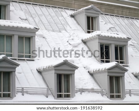 Roof of a house covered with snow