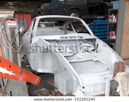 Car frame in a garage