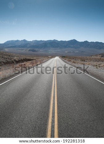 Straight road passing through landscape, Death Valley National Park, California, USA