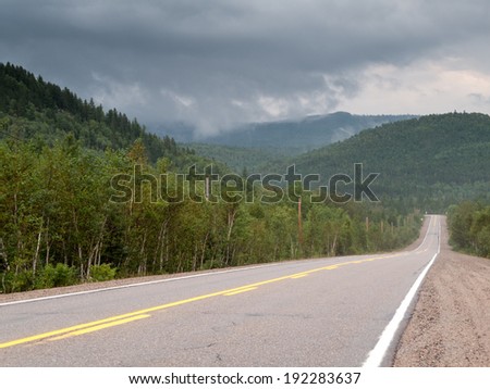 Road passing through forest, Quebec, Canada