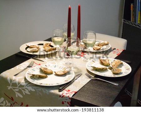 Oysters and white wine served in candlelight dinner