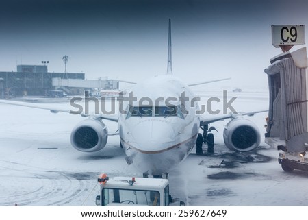Air plane in winter weather at an airport