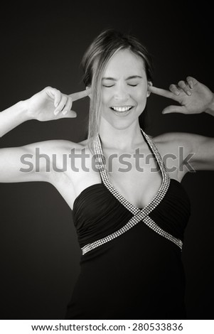 model isolated on plain background plugging ears with fingers