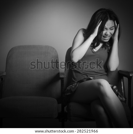 Attractive Asian girl in her 20s at the theatre isolate on a white background, black and white image
