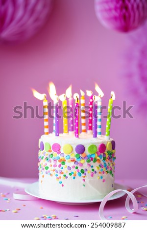 Birthday cake against a party background