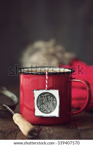 Enamel mug with festive tea bag tag