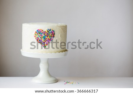 White cake with colorful heart