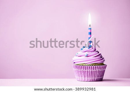 Purple birthday cupcake with copy space to side