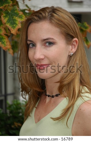 Pretty smile from model with fall leaves