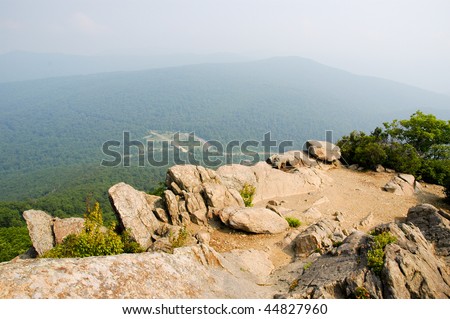 rolling green mountains from a rock peak in summer