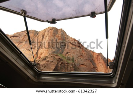 sandstone cliff through a tram window