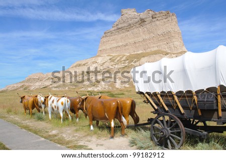 Scotts Bluff peak, covered wagon and oxen