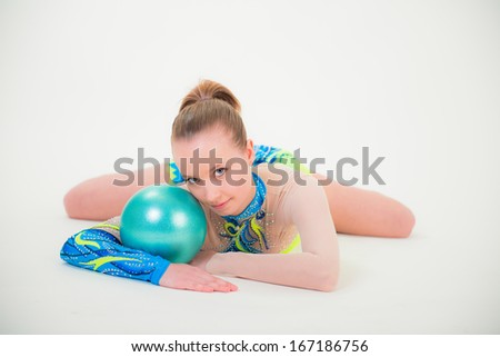 Little gymnast with ball