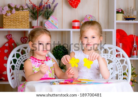 Art and craft activity in the kindergarten two cute little girls