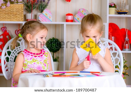 Art and craft activity in the kindergarten two cute little girls fun game