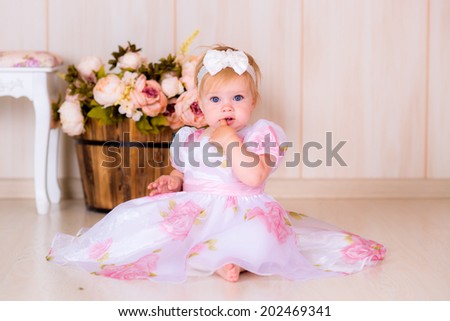 Little girl kid celebrate first Happy Birthday Party with  decor in the beautiful room