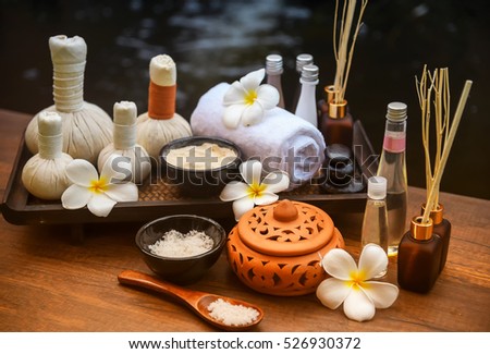 Soft and select focus Spa massage compress balls, herbal ball and treatments spa on the wooden.