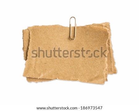 old brown sheet of paper for notes and paper clip