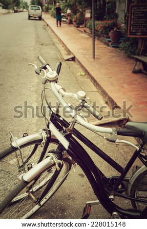 Vintage Bicycle Travel Resting in the city Street on Luang prabang, Laos.