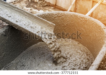 Pouring cement during for construction with with vintage tone.
