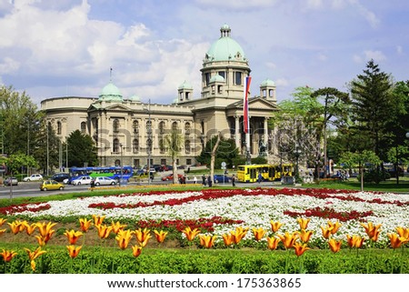 The building of the National assembly of Republic of Serbia in Belgrade with the beautiful colorful flowers in the front