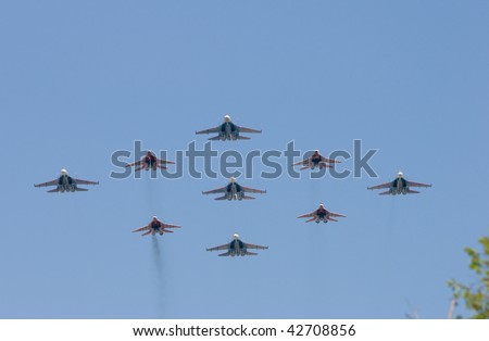 MOSCOW - MAY 9: Large group of battle-planes participate in winning parade on Red Square on May 09, 2008 in Moscow, Russia.