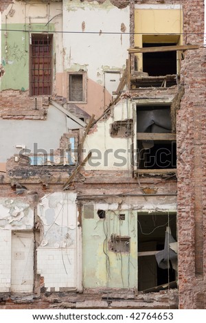 deserted building with fallen wall